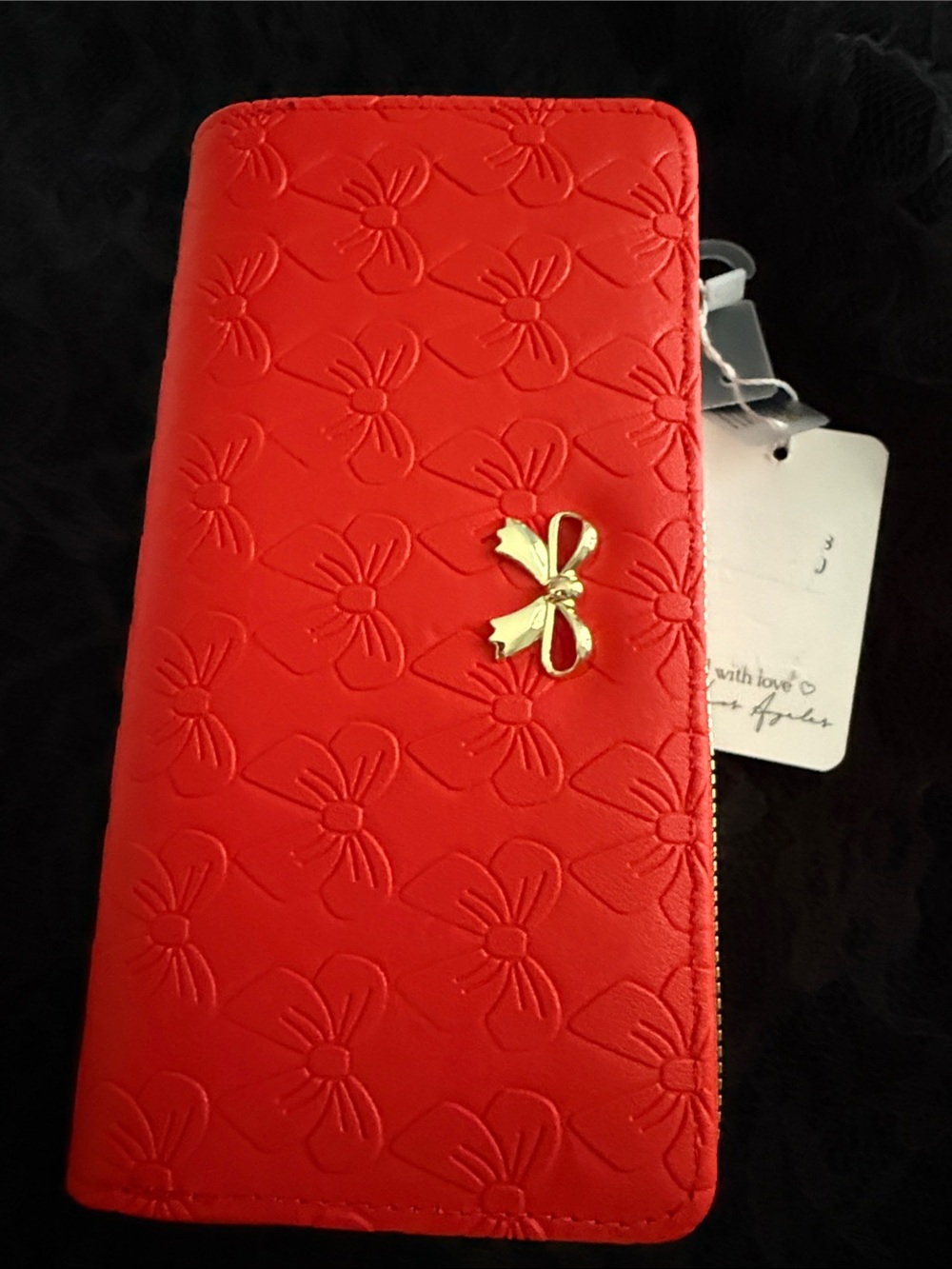 Women’s Red Bow-Embossed Zip Wallet with Gold Accent